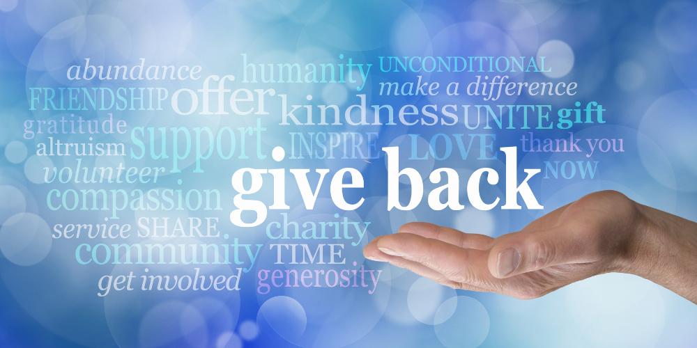 a hand reach out surrounded by a variety of words indicating generosity
