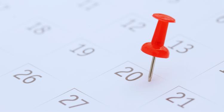 calendar close up with red pushpin